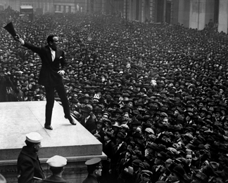Image of Douglas Fairbanks, a charismatic public speaker known for his eloquence and confidence. Illustrating the power of effective communication in financial advising.