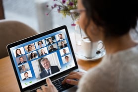 Woman attending a zoom meeting with clients. 