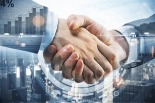 Close up of handshake on city background with business chart. Togetherness concept. Double exposure