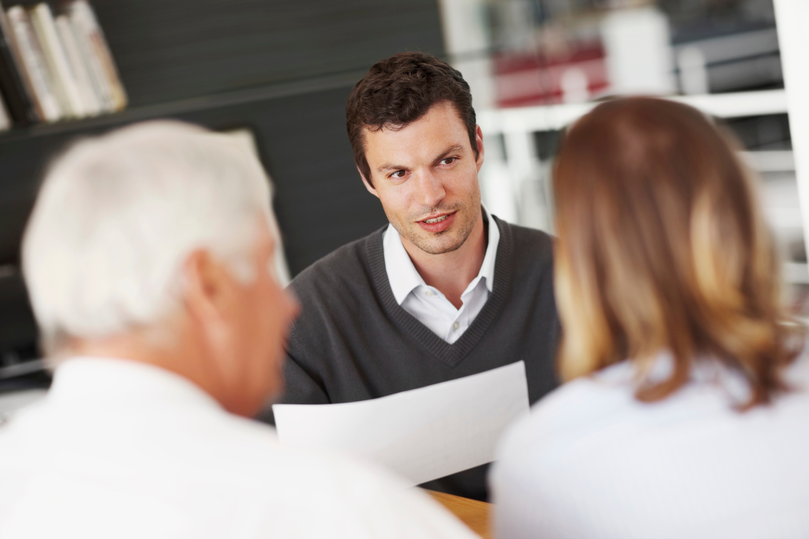 Financial advisor having a conversation with clients